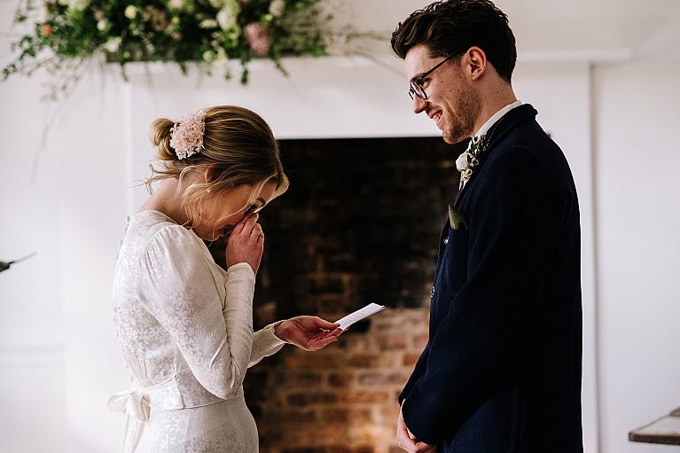 bride and groom saying vows